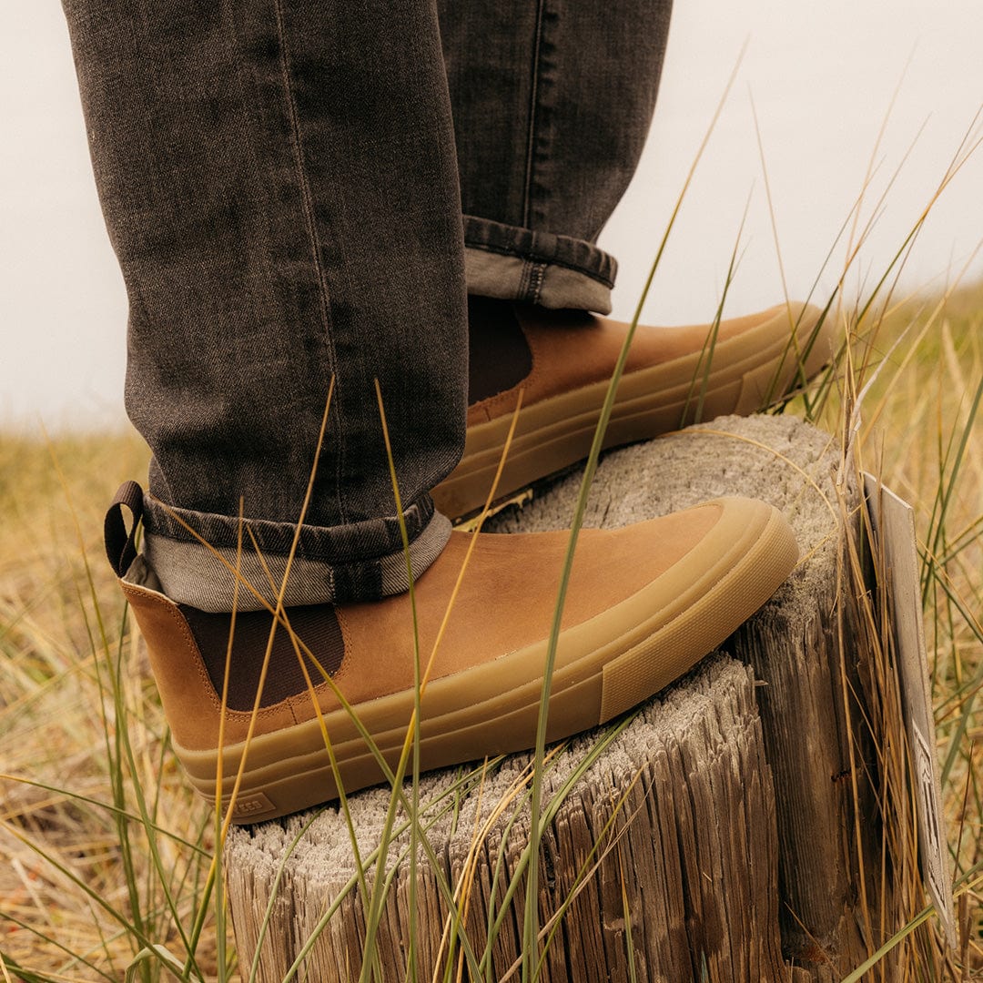 Full-body shot of someone outdoors wearing SeaVees Ballard Boot in Cashew