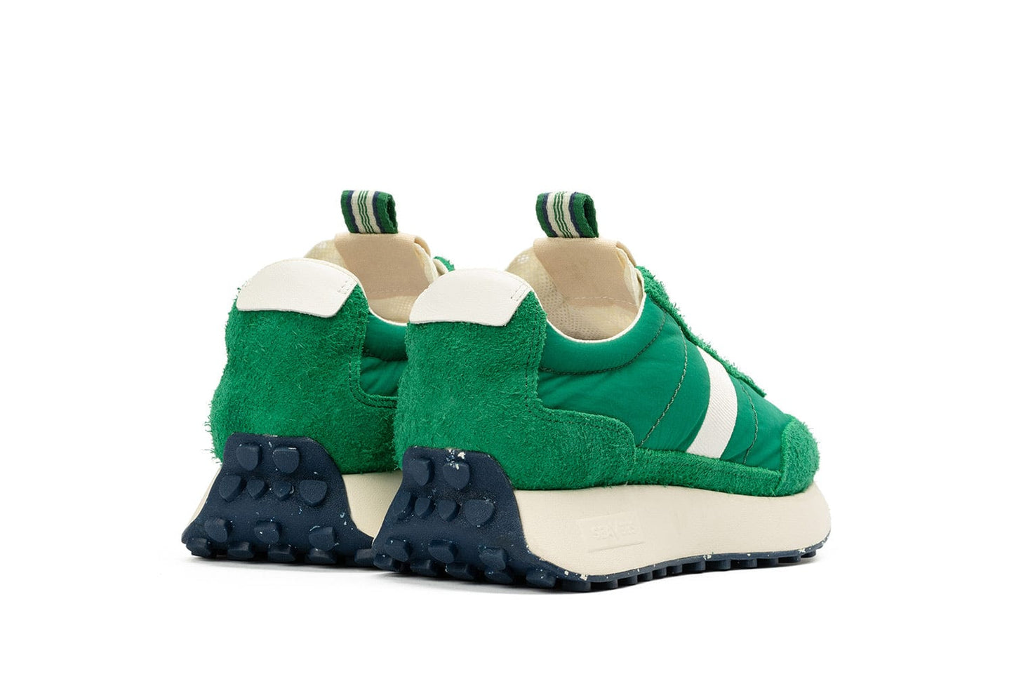 The SeaVees 'Acorn' sneakers in Grass Green from an angled rear view, showing the pull tab and sole detail.