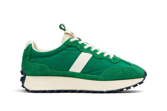 A single SeaVees 'Acorn' sneaker in Grass Green color, displayed in profile view against a white background.
