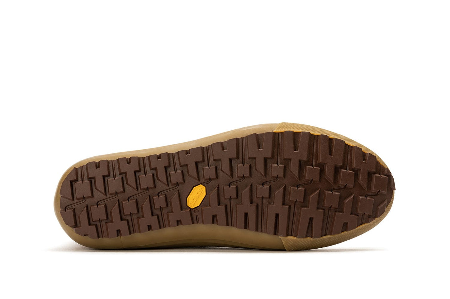 Close-up of the tread pattern on Cascade Range boots in Cashew/Olive, showcasing deep grooves for traction.
