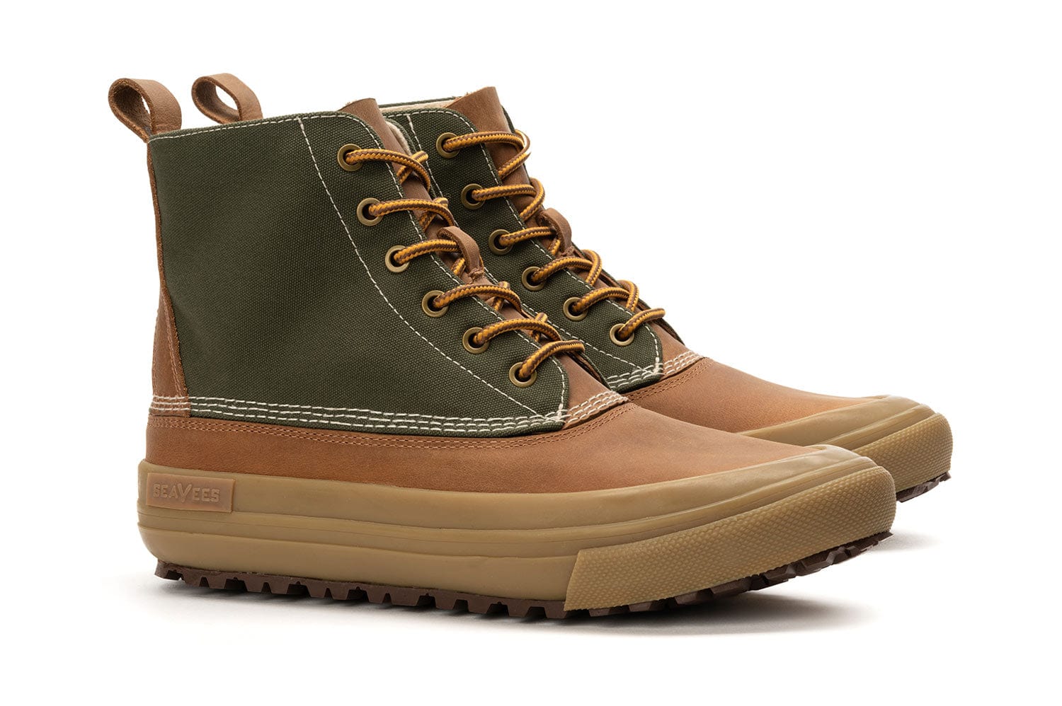 Cascade Range boot in Cashew/Olive featuring front lacing with brass eyelets and two-tone design, set against a plain backdrop.