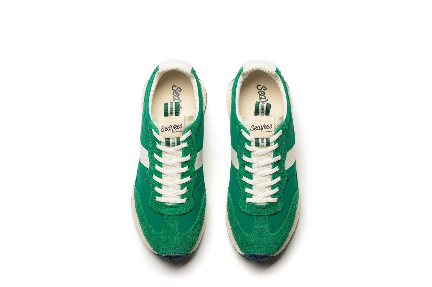 The SeaVees 'Acorn' sneakers in Grass Green from a top view, showing the white laces and branding.
