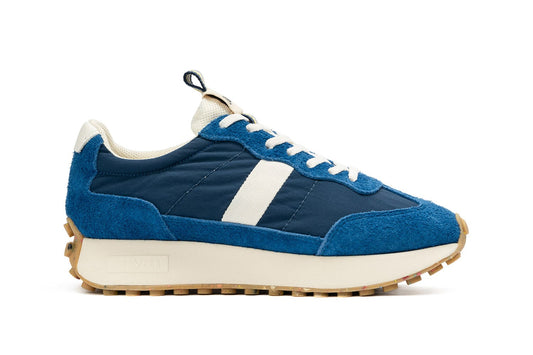 A single SeaVees 'Acorn' sneaker in Varsity Blue color, displayed in profile view against a white background.