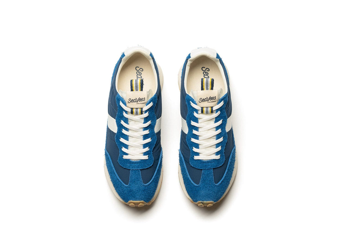 A top down view of the Acorn Trainer in Varsity Blue, showcasing branding and white laces.