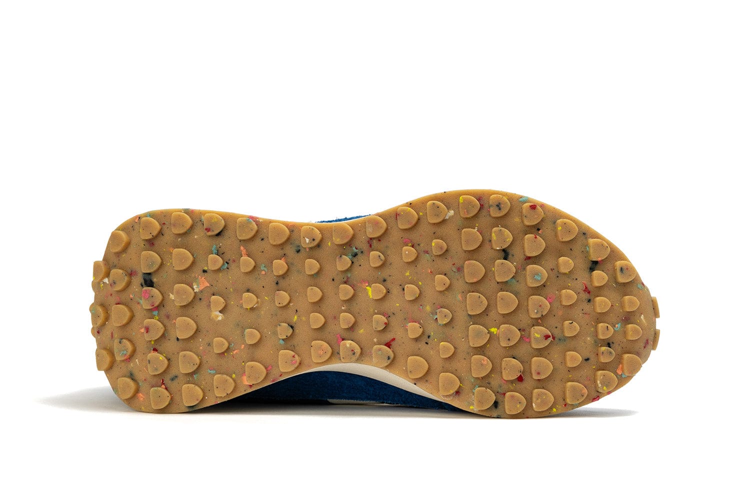 View of the sole of the Acorn Trainer in the color Varsity Blue, showcasing a recycled material sole.