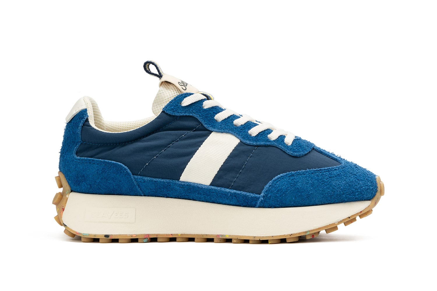Side view of the Acorn Trainer in the color Varsity Blue, showcasing the thick sole and side detail.
