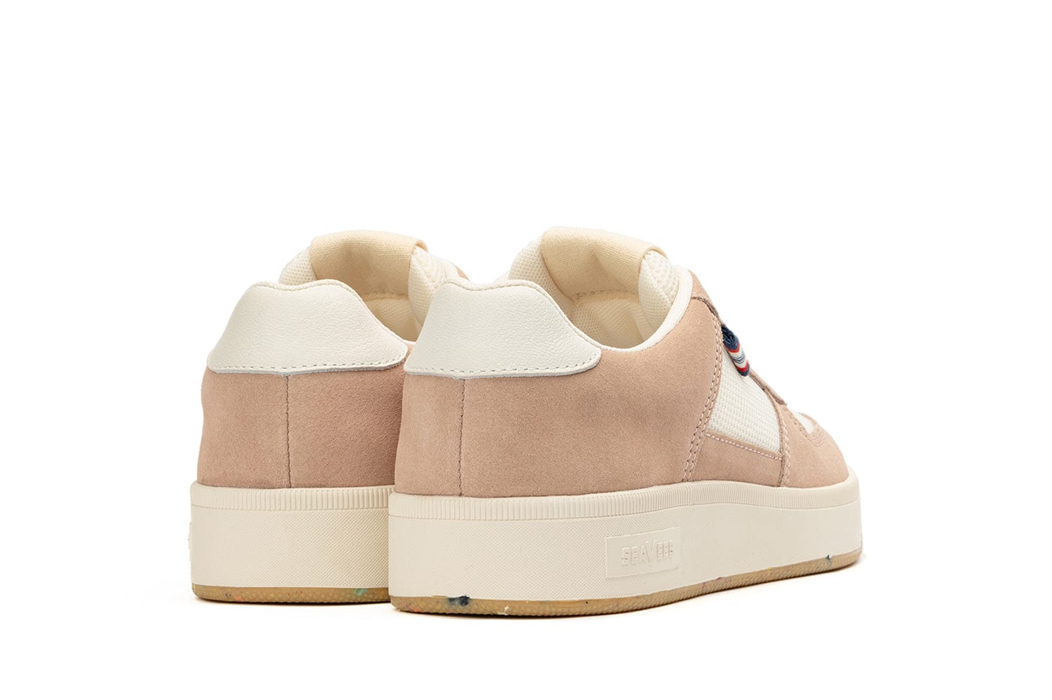 Rear-angled view of the Cardinal Sneaker in Pink Sand, showcasing the thick white sole and white leather detailing