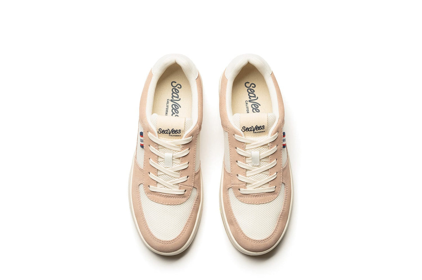Top-down view of the Cardinal Sneaker in Pink Sand, showcasing the vintage-style SeaVees branding on the inside of the shoe and on the tongue