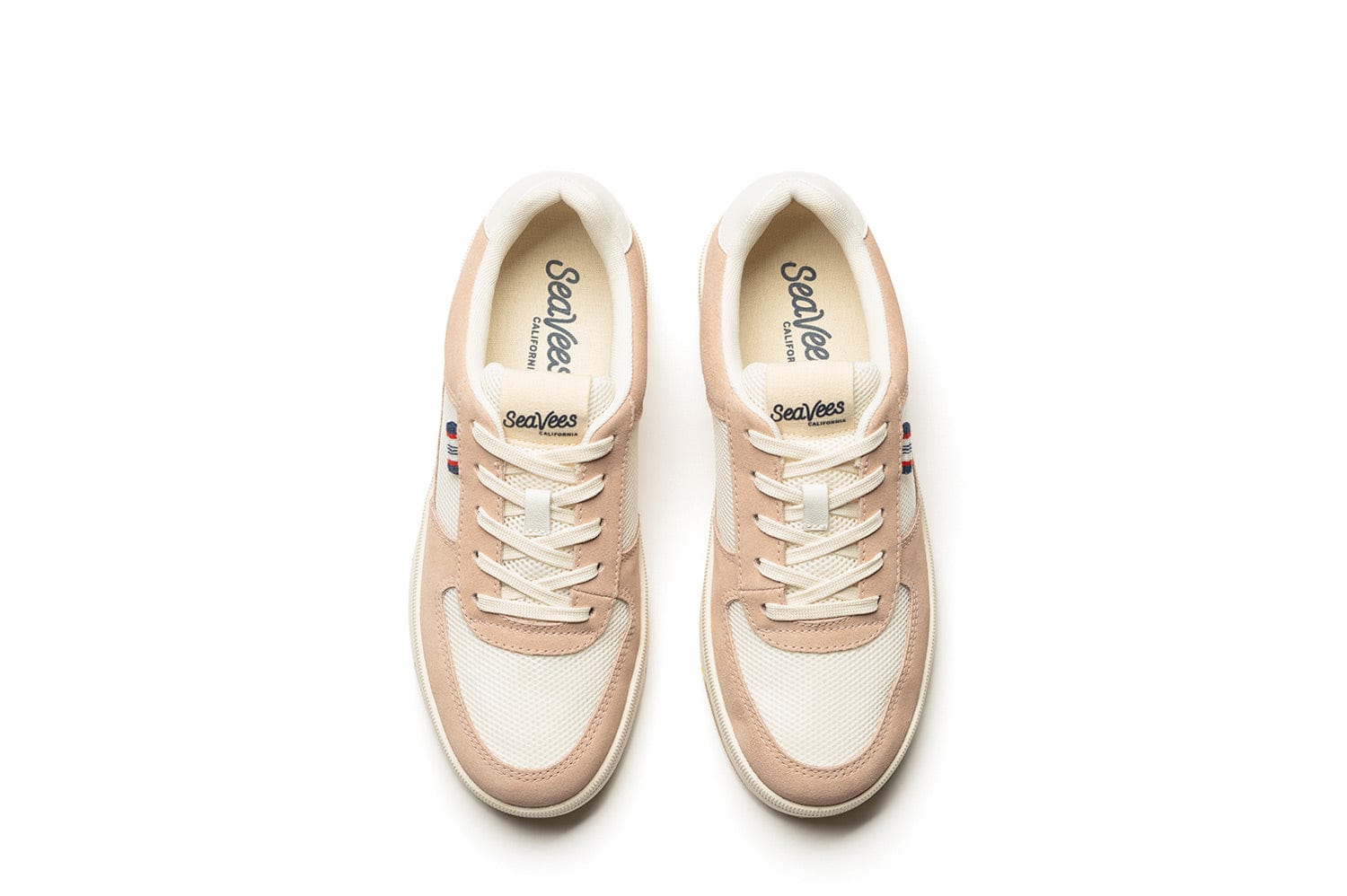 Top-down view of the Cardinal Sneaker in Pink Sand, showcasing the vintage-style SeaVees branding on the inside of the shoe and on the tongue